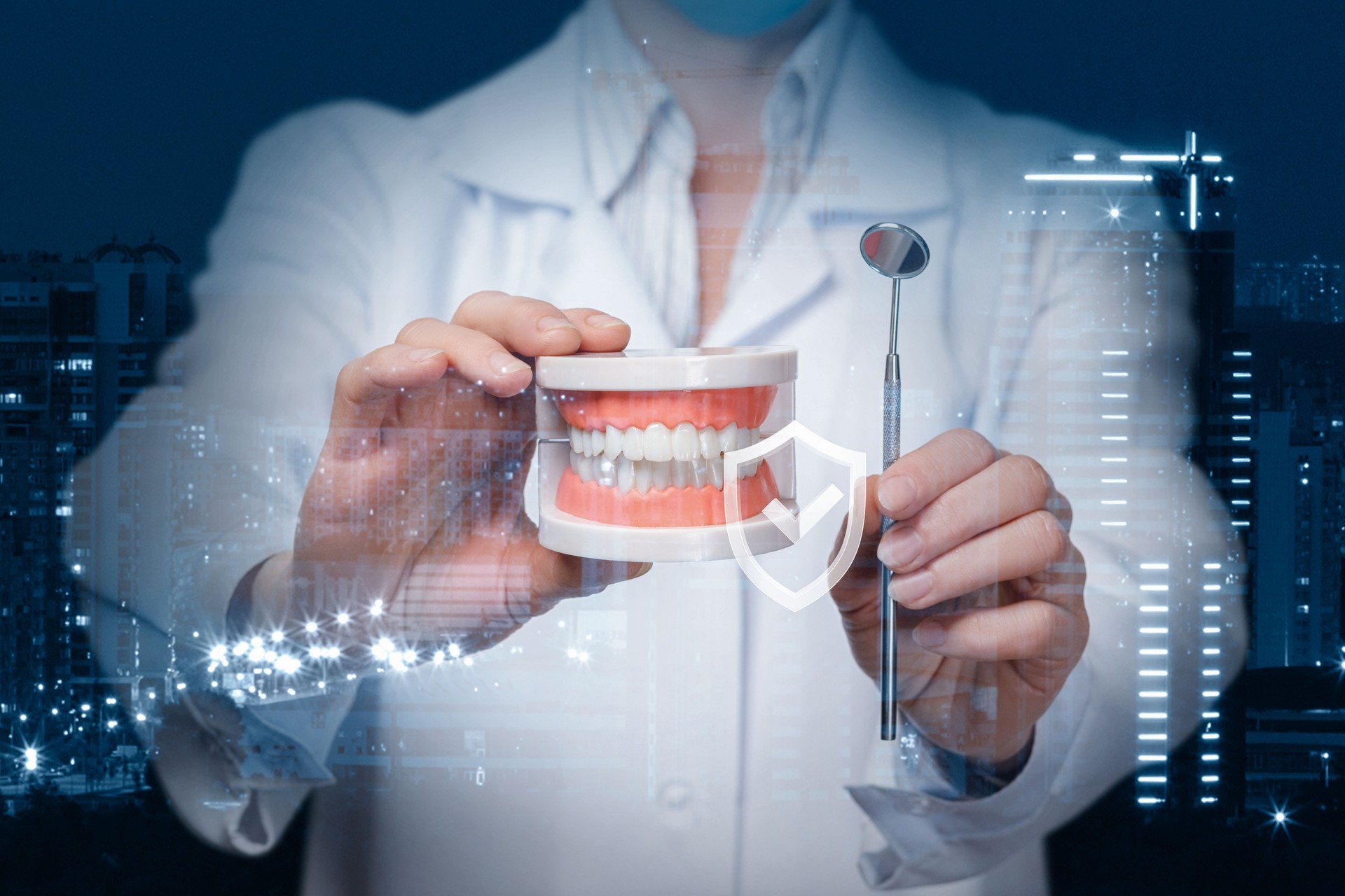 A dentist showing a denture model and a dental mirror with quality sign in front of.